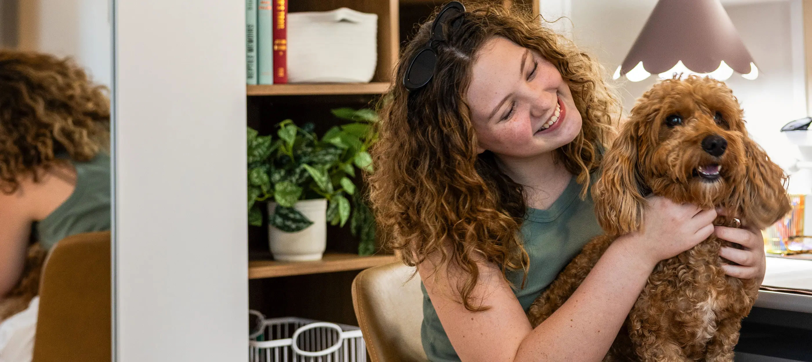 young woman cuddling a dog